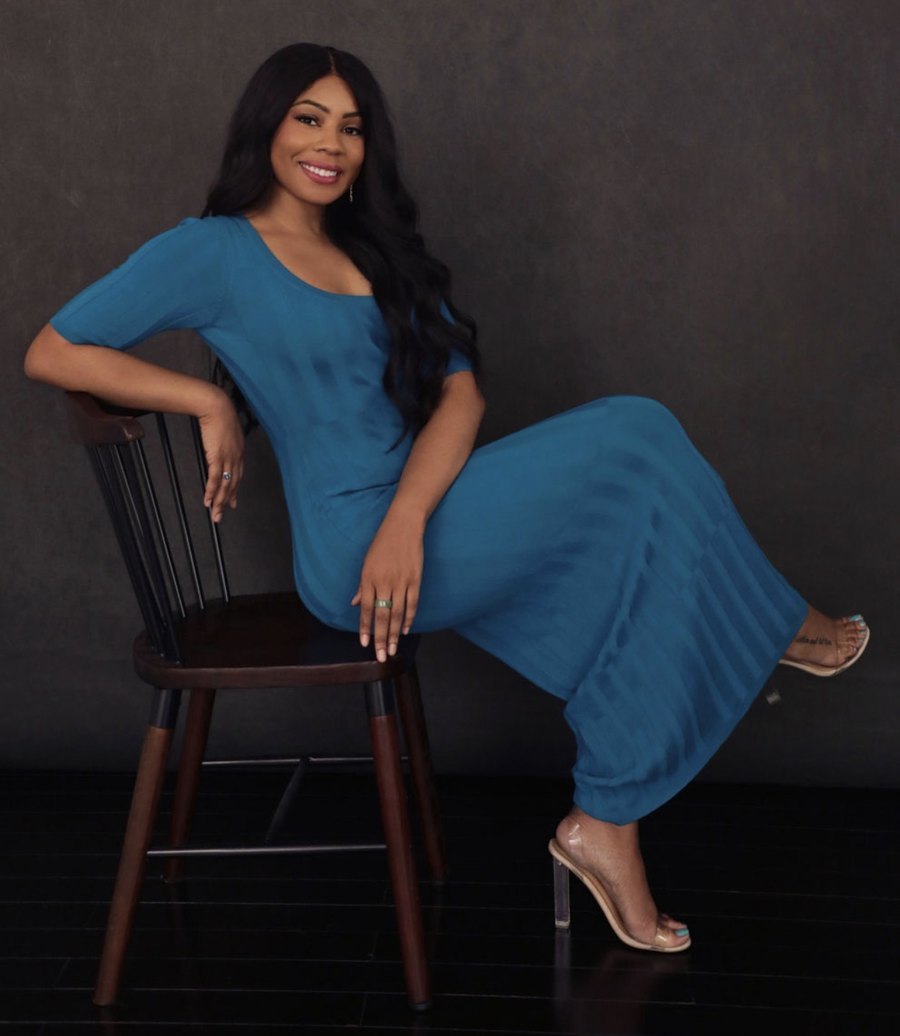 Karren Hodge, seated in a teal dress